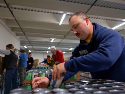 Man volunteering in warehouse